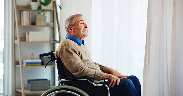 istock Wheelchair, thinking and elderly man in home for nostalgia, vision or remember past memory. Retirement, thoughts and senior person with disability, daydream or hope for rehabilitation with reflection 2224624528