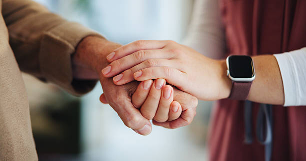 istock People, elderly care and holding hands in home for support, empathy and help in retirement. Senior man, caregiver and gesture with touch for sympathy, trust and grief counseling in consultation 2224624541