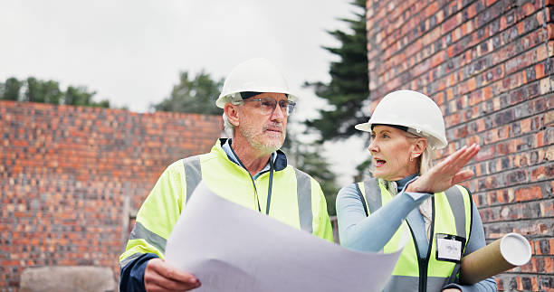istock Blueprint, discussion and construction team on site planning for building, maintenance or repairs. People, architecture and civil engineers in collaboration for renovation or industrial project. 2224624673