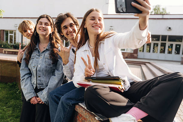 istock Making a selfie. Group of students are near university together 2224626610