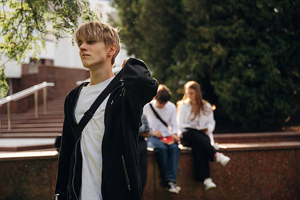 istock Posing, standing. Group of students are near university together 2224626692
