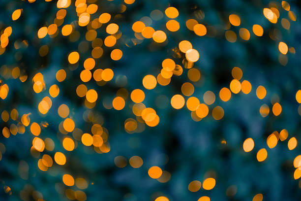 abstract blurred unfocused garland illumination festive lights in dusk blue environment background
