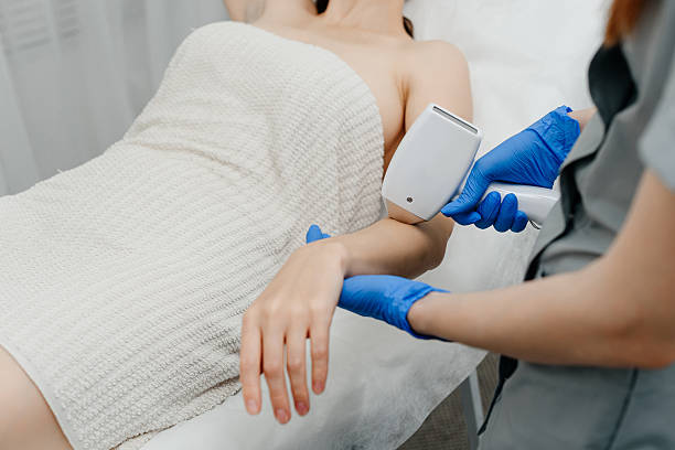 istock young woman on laser epilation procedure 2224629533
