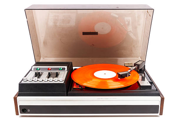Vintage turntable record player with red vinyl isolated on white background.
