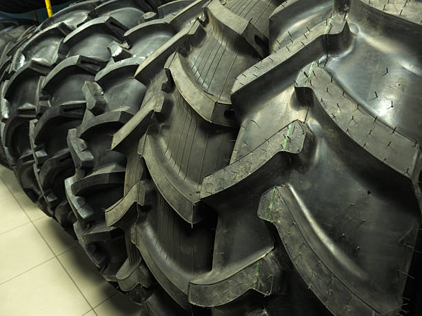 istock Multiple stacked tractor tires in industrial warehouse during daytime 2224630856
