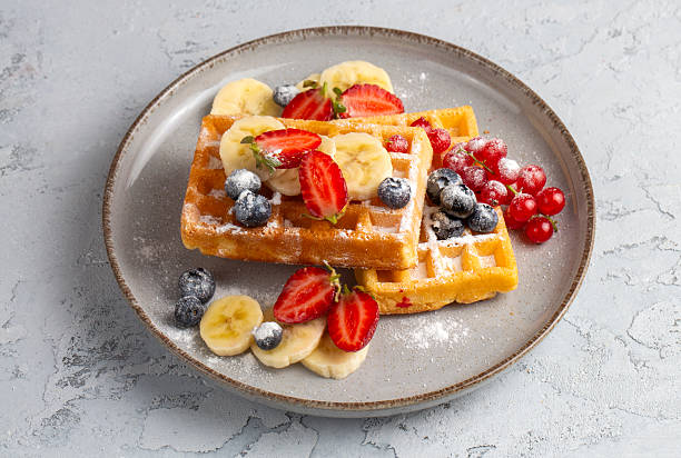 istock Delicious fresh baked belgian waffles with berries and fruit 2224632494
