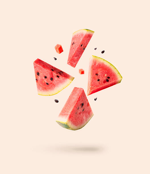 istock Watermelon pieces isolated with ceeds flying isolated on white. Falling slices set. 2224634967