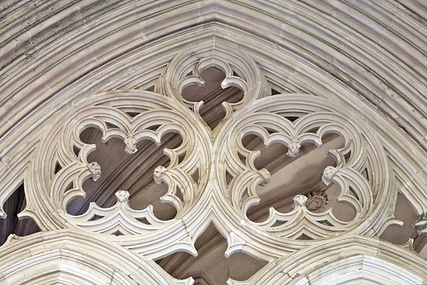 Batalha Monastery's archways feature intricate stone carvings that showcase its historical significance and craftsmanship.