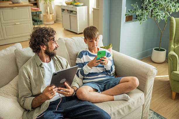 istock Father and son bonding at home 2224635636