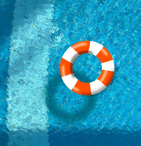 istock Orange buoy on swimming pool surface with vibrant blue color 2224639690