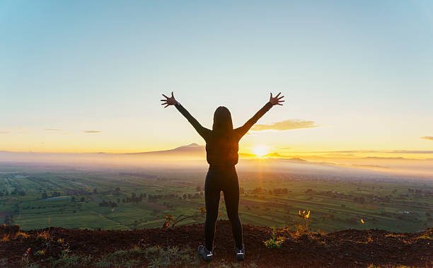 istock Hiker celebrating sunrise on scenic mountain top 2224639994