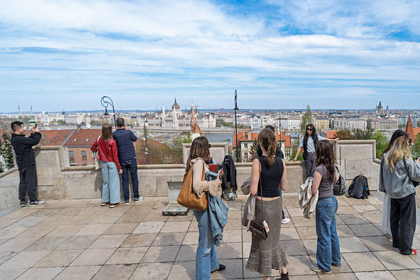 Buda, Budapest, Hungary - April, 2025:  Fishermen's Bastion in Buda, Budapest.  There are tourists on the walls around the Bastion.