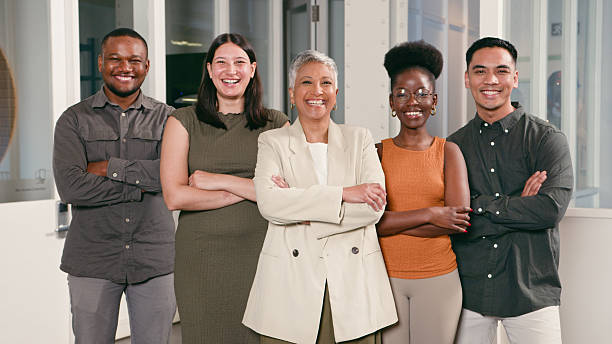 istock Diverse Group of Professionals Smiling Confidently in a Modern Office Environment 2224644642