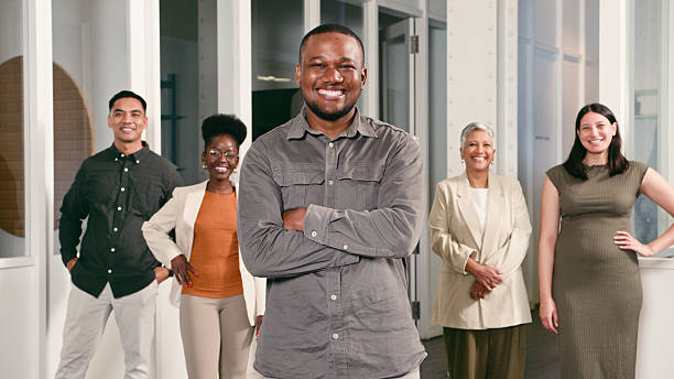 istock Smiling Professionals Standing in Office Environment Showcasing Team Diversity and Cooperation 2224644911