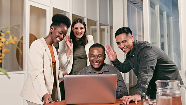 istock Diverse Team Collaborating and Celebrating Success Around a Laptop in a Professional Workspace 2224645226