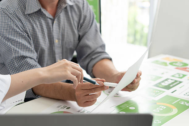 istock A diverse business team analyzing environmental charts and graphs in a collaborative meeting to create sustainable strategies in a modern office. 2224646086