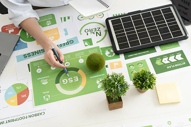 istock A diverse business team analyzing environmental charts and graphs in a collaborative meeting to create sustainable strategies in a modern office. 2224646104