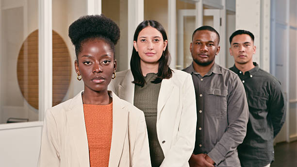 istock Diverse Group of Professionals Standing Confidently in an Office Setting 2224646592