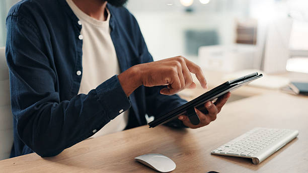istock Man, hands or tablet in office for business, project planning and scroll on networking platform. Employee, tech and typing at desk for communication, email draft or browsing for productivity research 2224647190