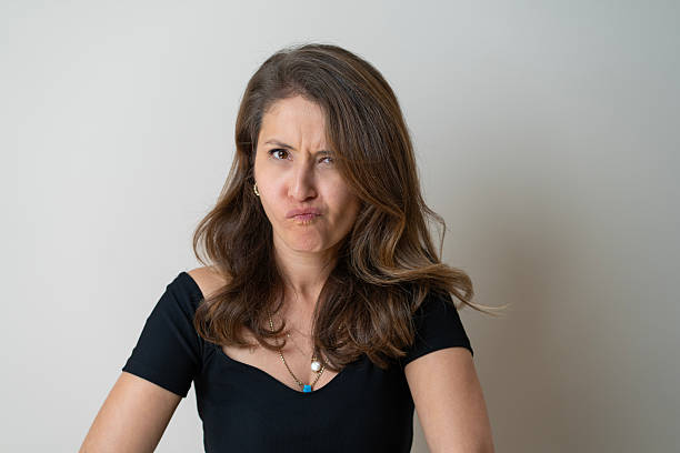Mid adult woman making facial expression