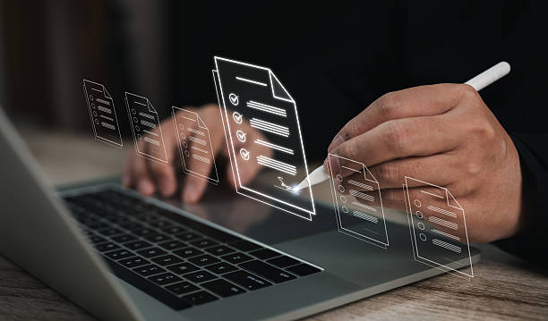 istock Businessman writing with digital pen on floating policies document interface, symbolizing document management, compliance, checklist procedures, and policy review process in a digital workplace. 2224653763