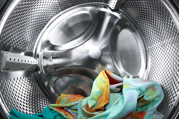 istock Washing machine with laundry as background, closeup 2224654454