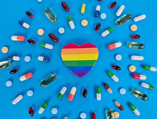 istock A vibrant heart shape in rainbow colors sits at the center, surrounded by assorted capsules and pills, illustrating the connection between health 2224654890