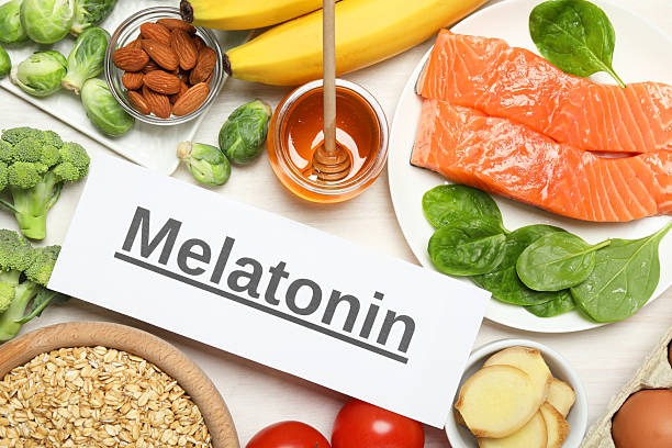 istock Word Melatonin and different products on white wooden table, flat lay 2224655181