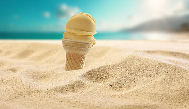 istock Ice cream on beach sand – summer treat, dessert and seaside refreshment concept. 2224655196