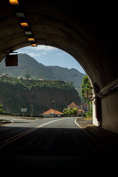 istock Tunnel exit view of coastal mountain road. Madeira 2224658833