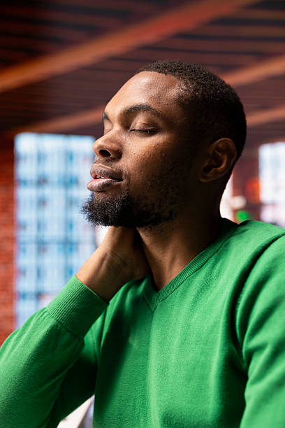 istock Overworked man at home closing eyes to relax after long hard day at work 2224664387