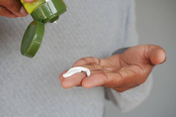istock Applying cream to hand for skincare routine 2224666260
