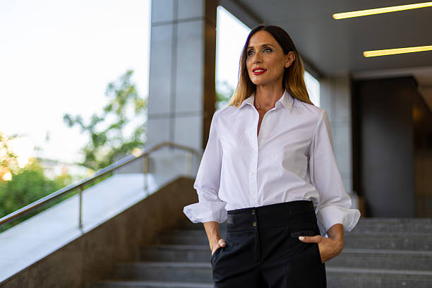 istock Confident businesswoman standing in modern office 2224668894