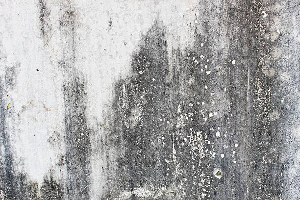 istock Close-Up Texture of Weathered Painted Wall with Exposed Concrete 2224672472