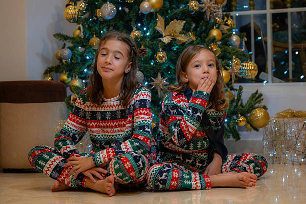 istock girls at christmas 2224674159