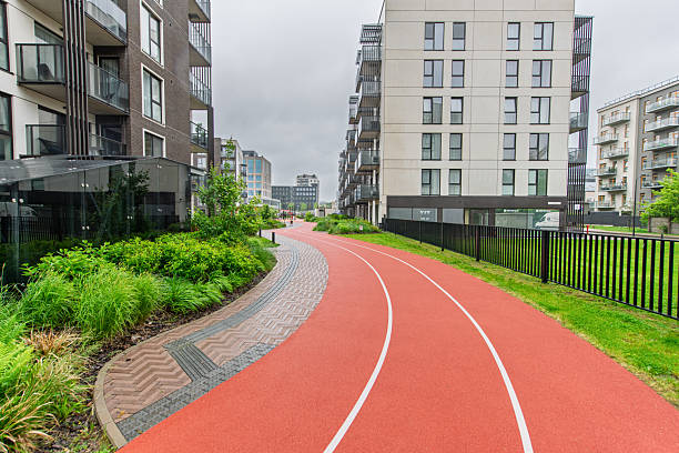 istock Modern Residential Apartment Complex with Jogging Path and Green Outdoor Area 2224674164