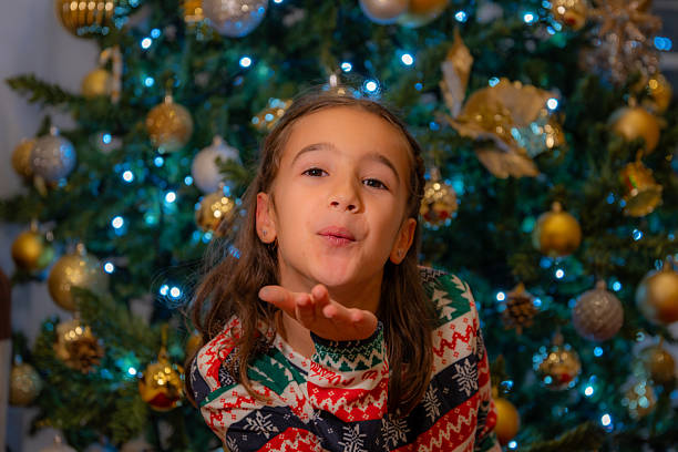 istock girl at christmas 2224674185