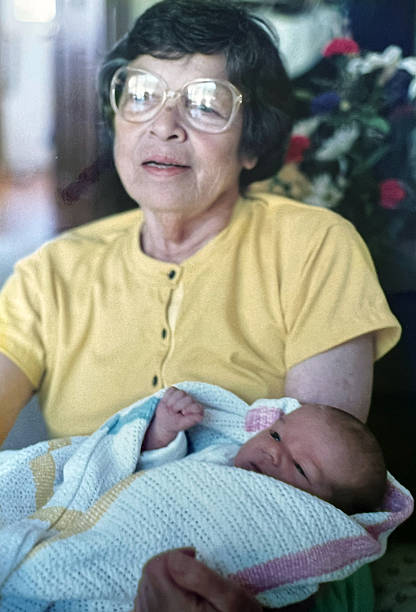 istock Grandma Holding Newborn 1987 2224675083