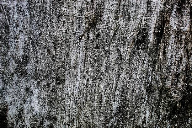 black background, Detailed surface featuring cracked paint layers revealing the concrete underneath, perfect for texture and background.