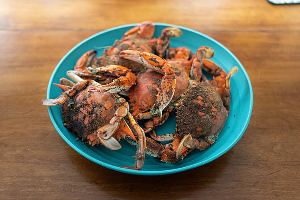 Overhead view of a plate of cooked, ready to eat Chinese style steamed crab dish