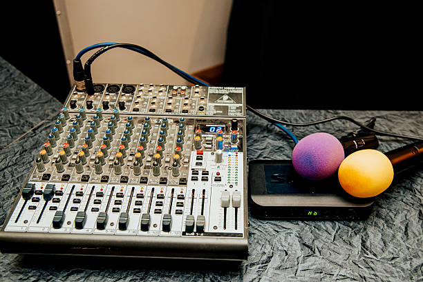 istock DJ and event host equipment lying on table, music mixer and microphone close up 2224680160