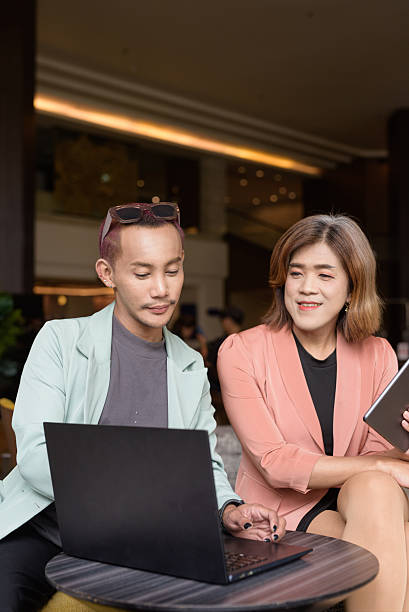 istock Transgender and non-binary coworkers working remotely in cafe 2224680331