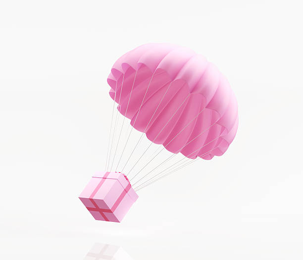 istock Pink Parachute And Gift Box Isolated On White Background - Gift And Promotion Concept 2224680951