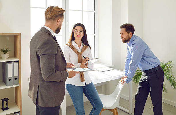istock Successful business team working and communicating in office 2224681269