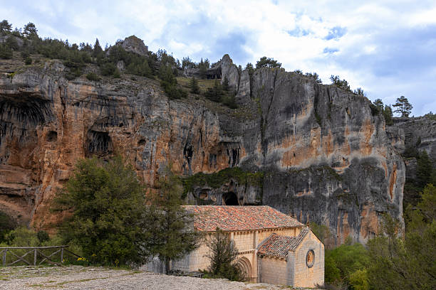 istock Small hermitage located in a beautiful natural environment under a large rocky mountain in soria, spain 2224683530