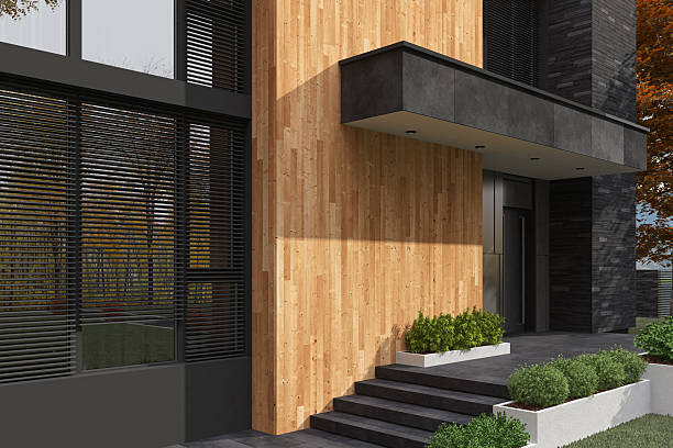 istock Cube-Shaped Modern House with Stone and Wood Facade in Autumn Setting 2224685860