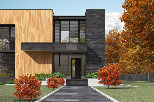istock Cube-Shaped Modern House with Stone and Wood Facade in Autumn Setting 2224685888
