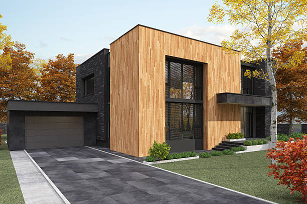 istock Cube-Shaped Modern House with Stone and Wood Facade in Autumn Setting 2224685911