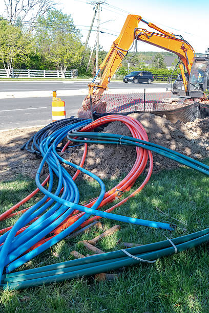 excavator and equipment for laying broadband internet cables underground.