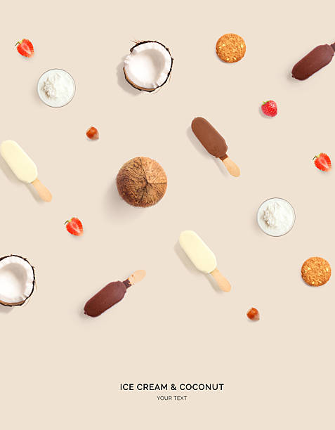 Creative layout made of ice cream, coconut, cookies and strawberry on beige background. Flat lay. Food concept. Macro  concept.